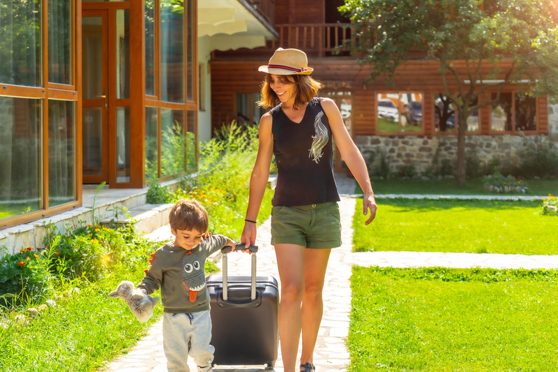 mom and son pulling suitcase