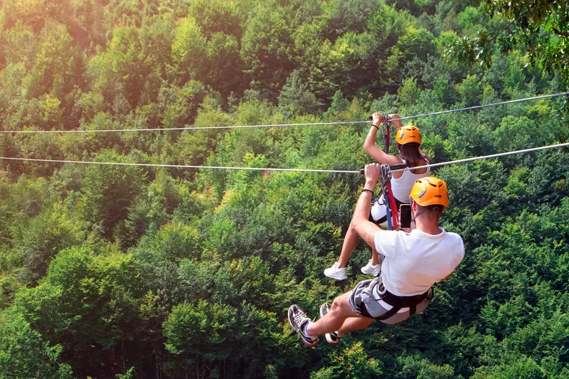 people ziplining in the smoky mountains