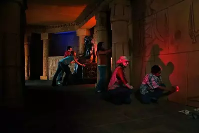 people playing the tomb