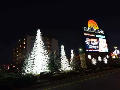 the island in pigeon forge sign with winter lights