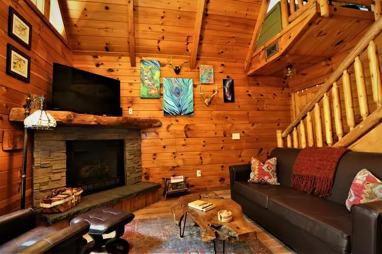 stone fireplace in living room of Always & Forever cabin