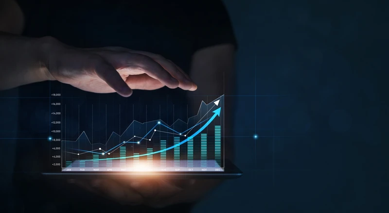 man holding a graph showing a revenue projection